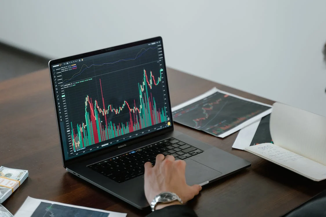 Laptop with trading charts
